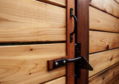 Landscape construction project, cedar fence and gate with decorative hardware.