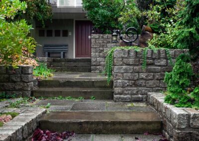 Highbury garden front entry with sustainable reclaimed wall and hardscape surface