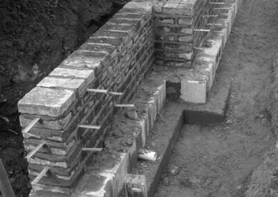 Highbury garden wall under construction, reclaimed backing material