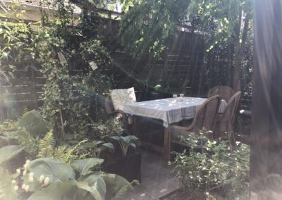 Outdoor dining table in lush vancouver back garden