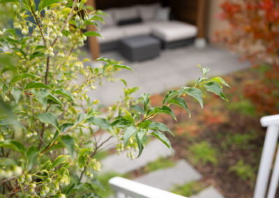 Modern backyard design in Vancouver with seating area and stone paving