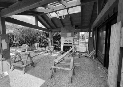 Covered seating area and outdoor fireplace under construction in west Vancouver
