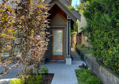 Residential entry pathway design in East Vancouver — concrete paver walkway with Purple Beech and ornamental grass planting by 161 Design Studio.