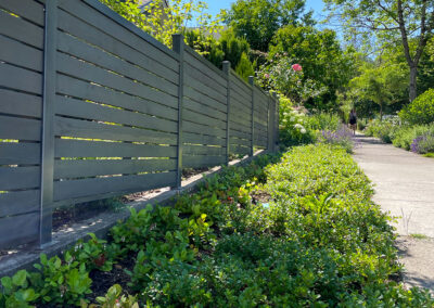 Cedar and aluminum privacy fencing and native boulevard planting — residential landscape design in East Vancouver by 161 Design Studio.